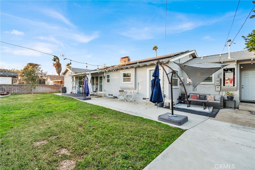 133 East Van Koevering Street Rialto, CA 92376 - Photo 20 of 23 a view of a house with backyard and a slide