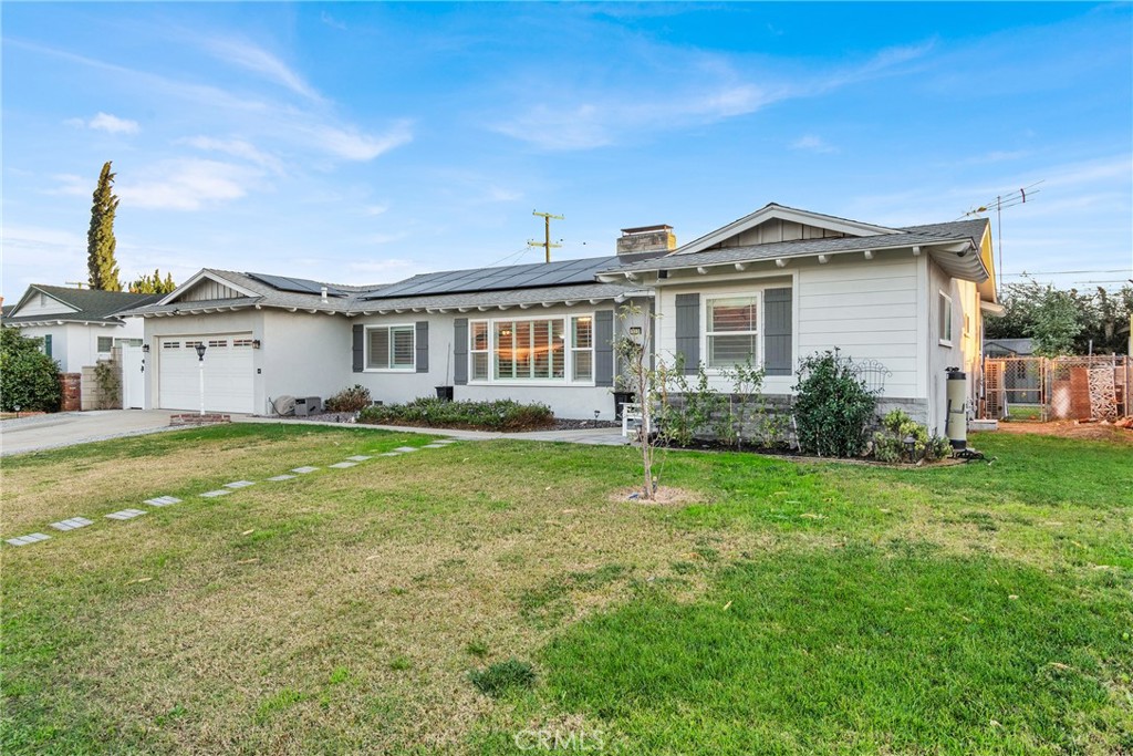 133 East Van Koevering Street Rialto, CA 92376 - Photo 3 of 23 a front view of a house with a garden