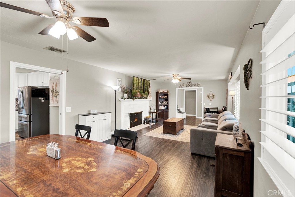 133 East Van Koevering Street Rialto, CA 92376 - Photo 7 of 23 a living room with fireplace furniture and a wooden floor