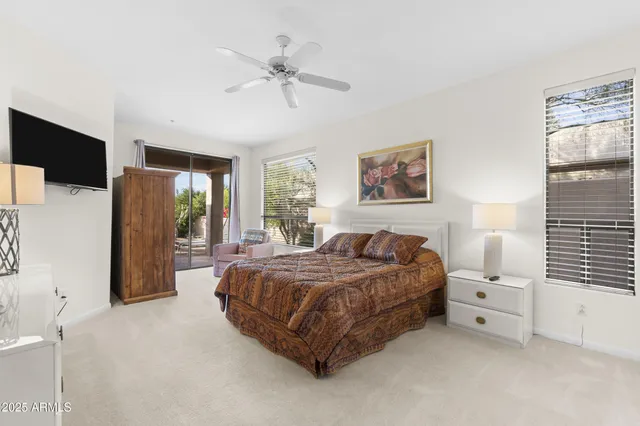 a bed room with a bed and a chandelier