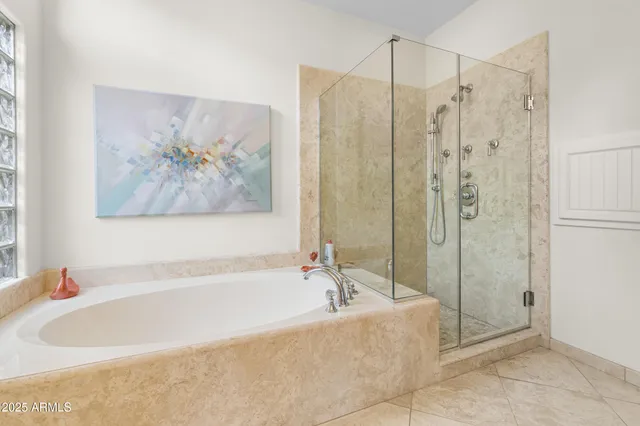 a bathroom with a bathtub and a shower