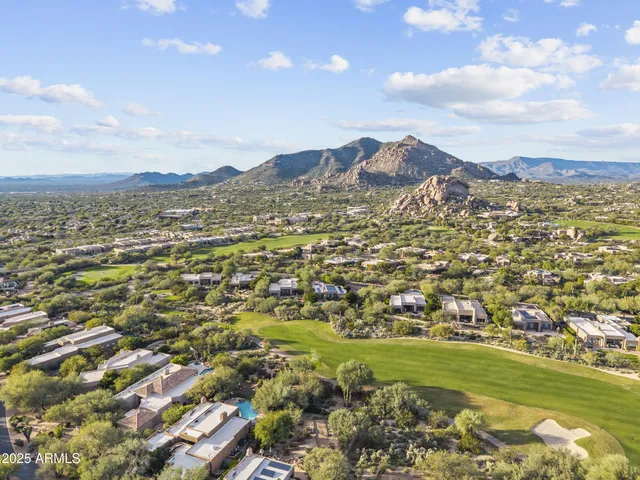 a view of a city with mountains in the background