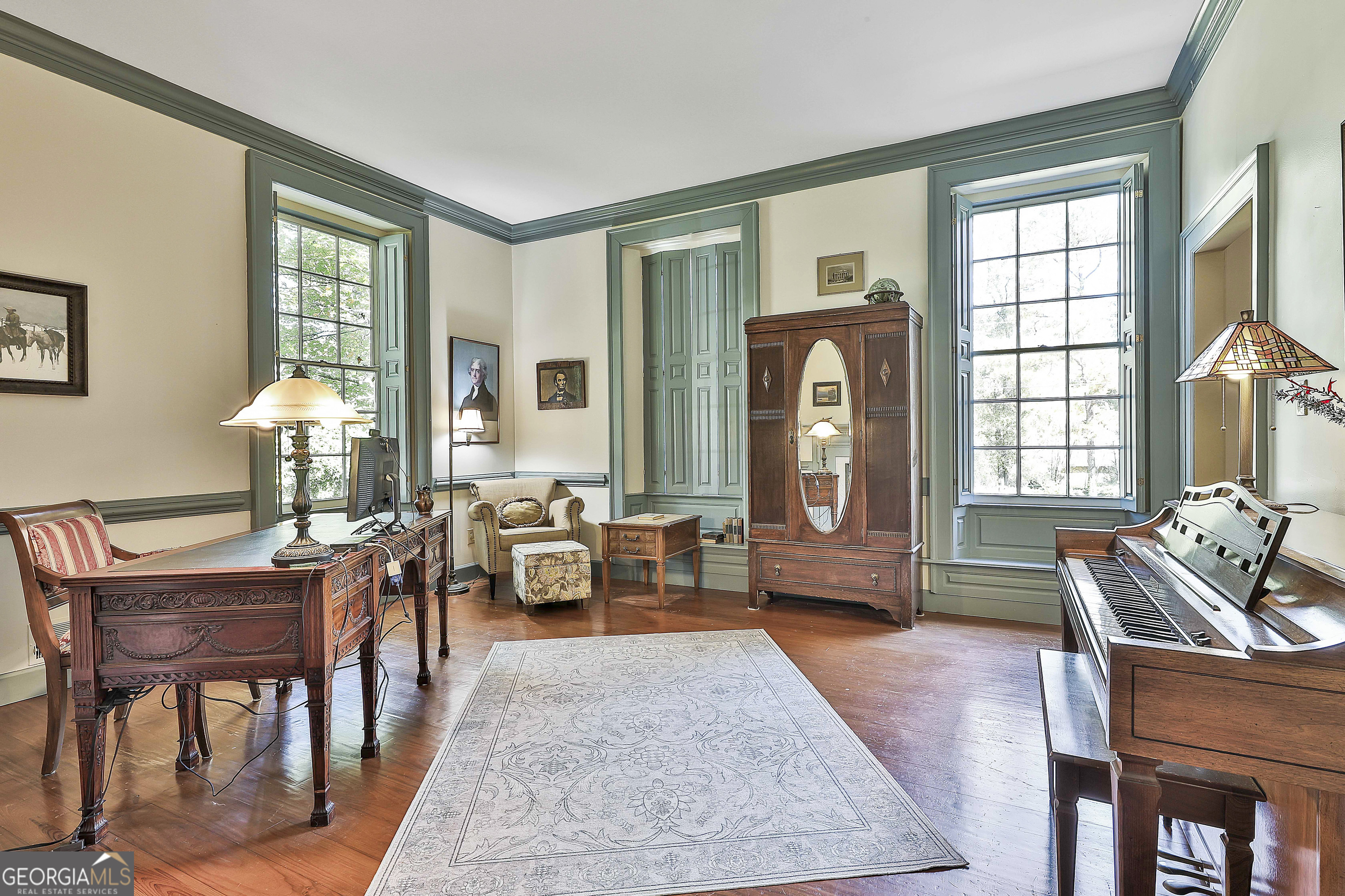 405 North Pine Hill Road Griffin, GA 30223 - Photo 11 of 72 a living room with furniture two window and wooden floor
