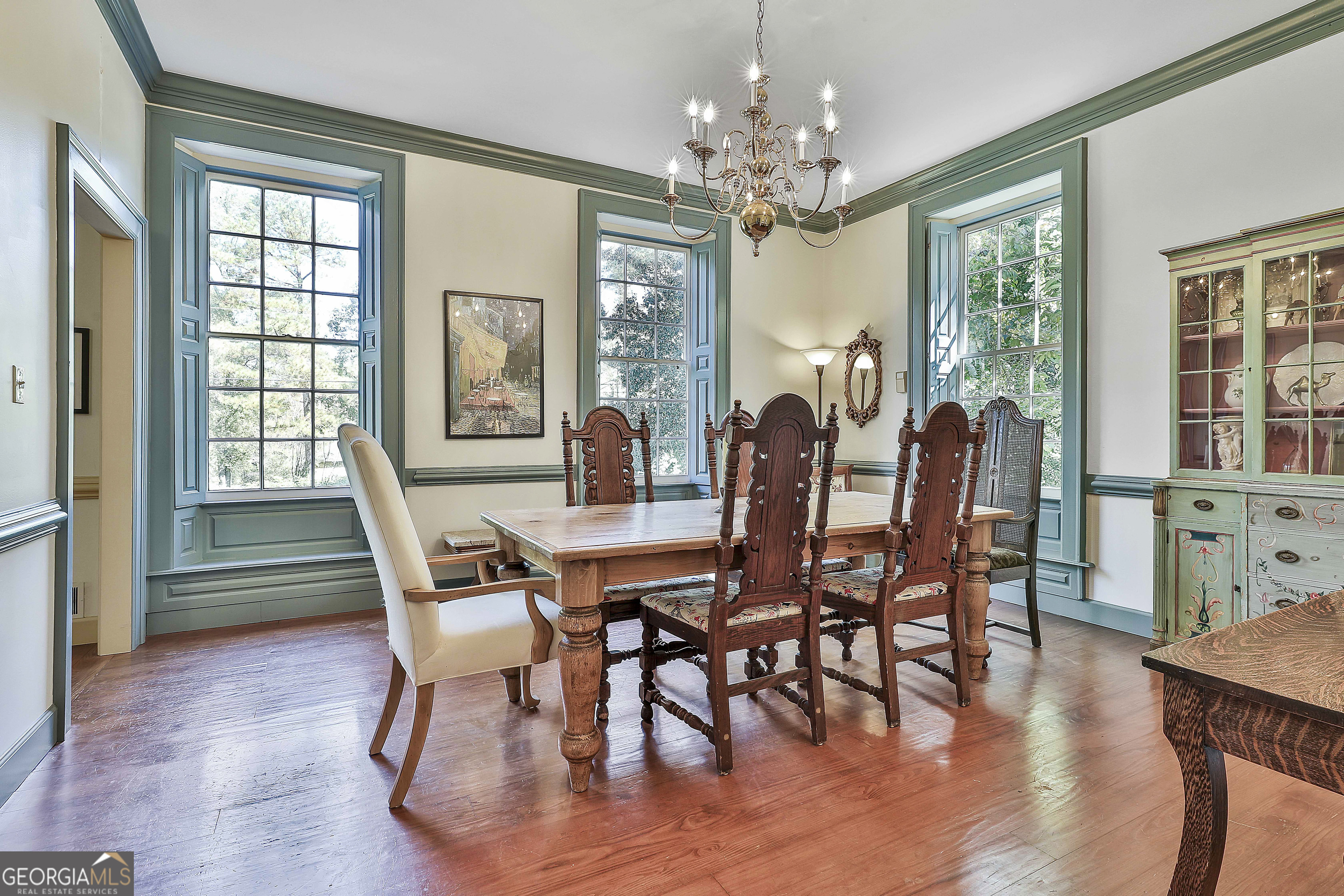 405 North Pine Hill Road Griffin, GA 30223 - Photo 14 of 72 a view of a dining room with furniture window and wooden floor