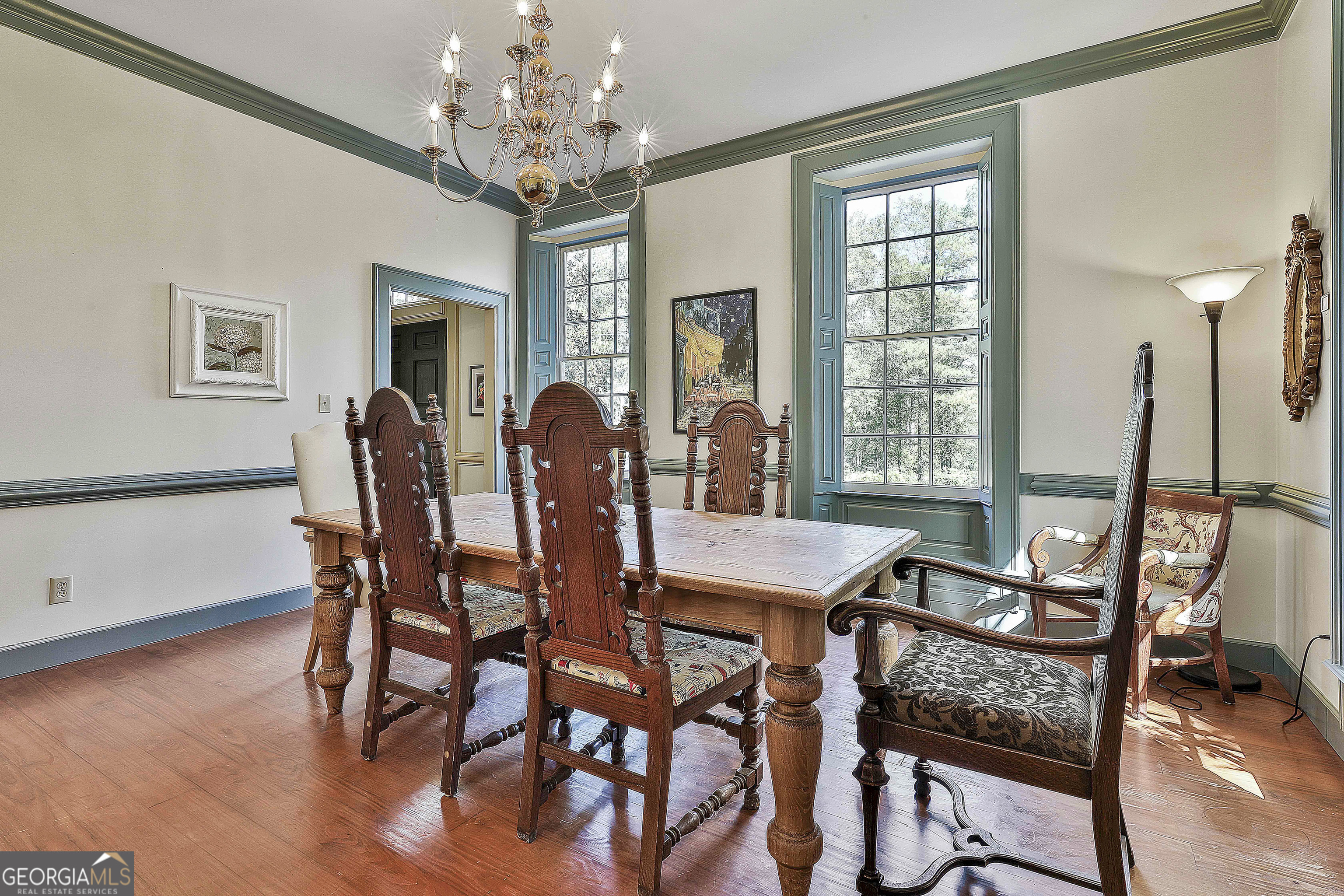 405 North Pine Hill Road Griffin, GA 30223 - Photo 15 of 72 a view of a dining room with furniture window and wooden floor