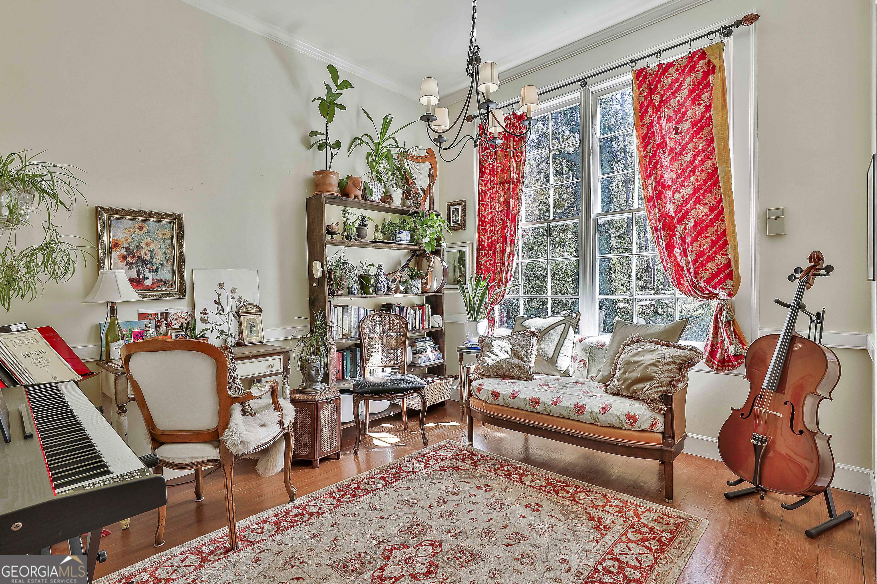 405 North Pine Hill Road Griffin, GA 30223 - Photo 19 of 72 a living room filled with furniture and a chandelier
