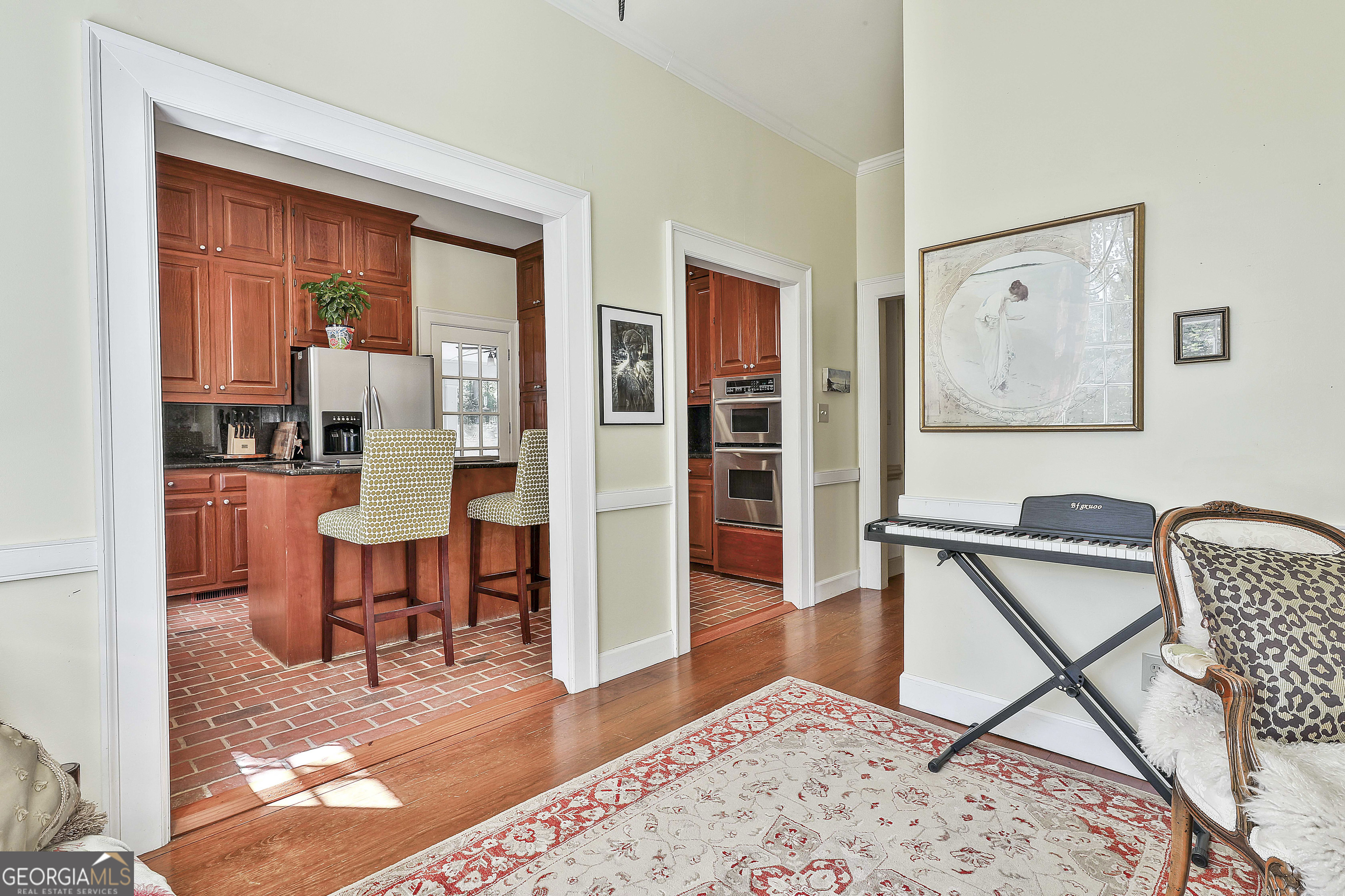 405 North Pine Hill Road Griffin, GA 30223 - Photo 20 of 72 a living room with furniture and a wooden floor