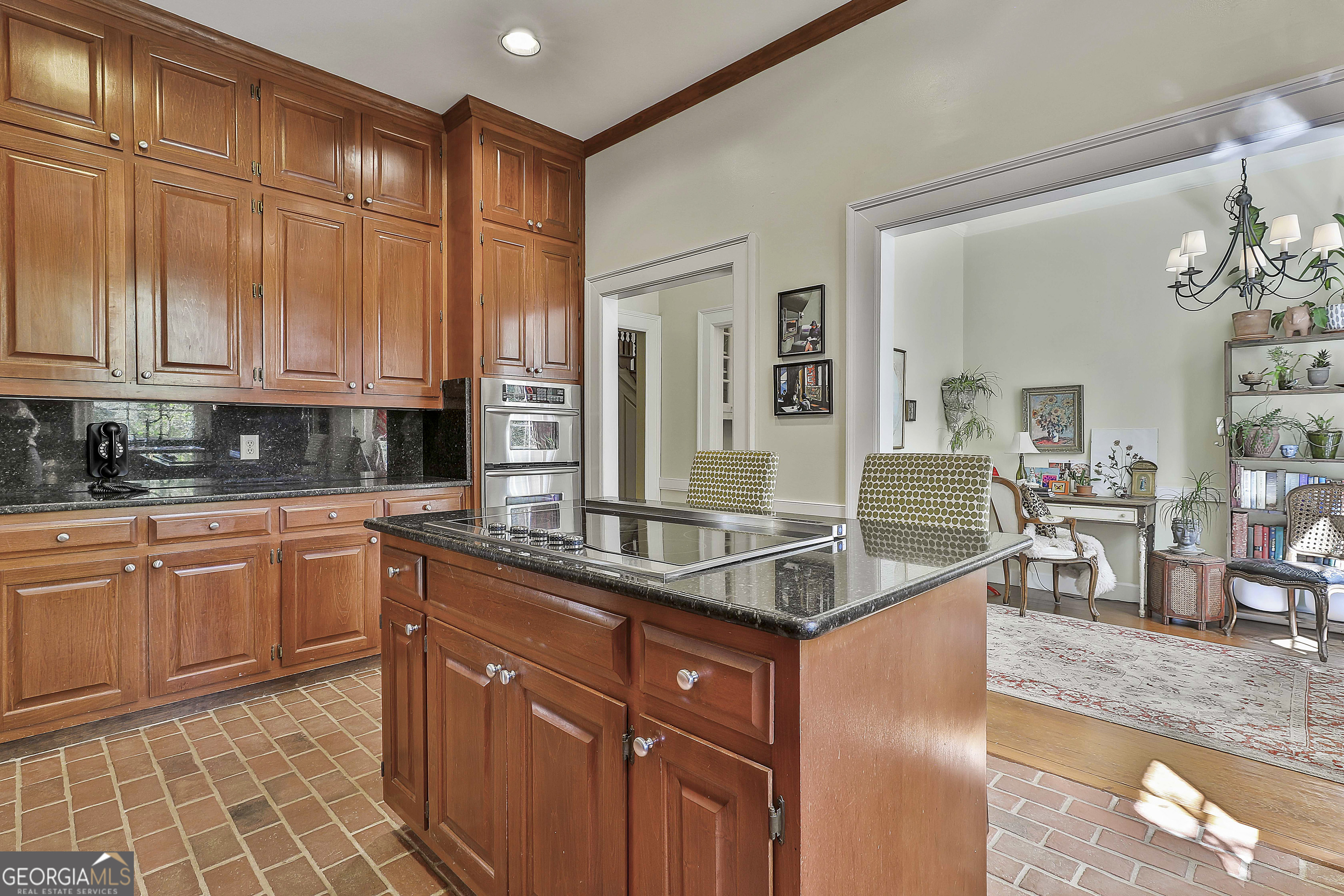 405 North Pine Hill Road Griffin, GA 30223 - Photo 23 of 72 a kitchen with stainless steel appliances granite countertop a sink and cabinets