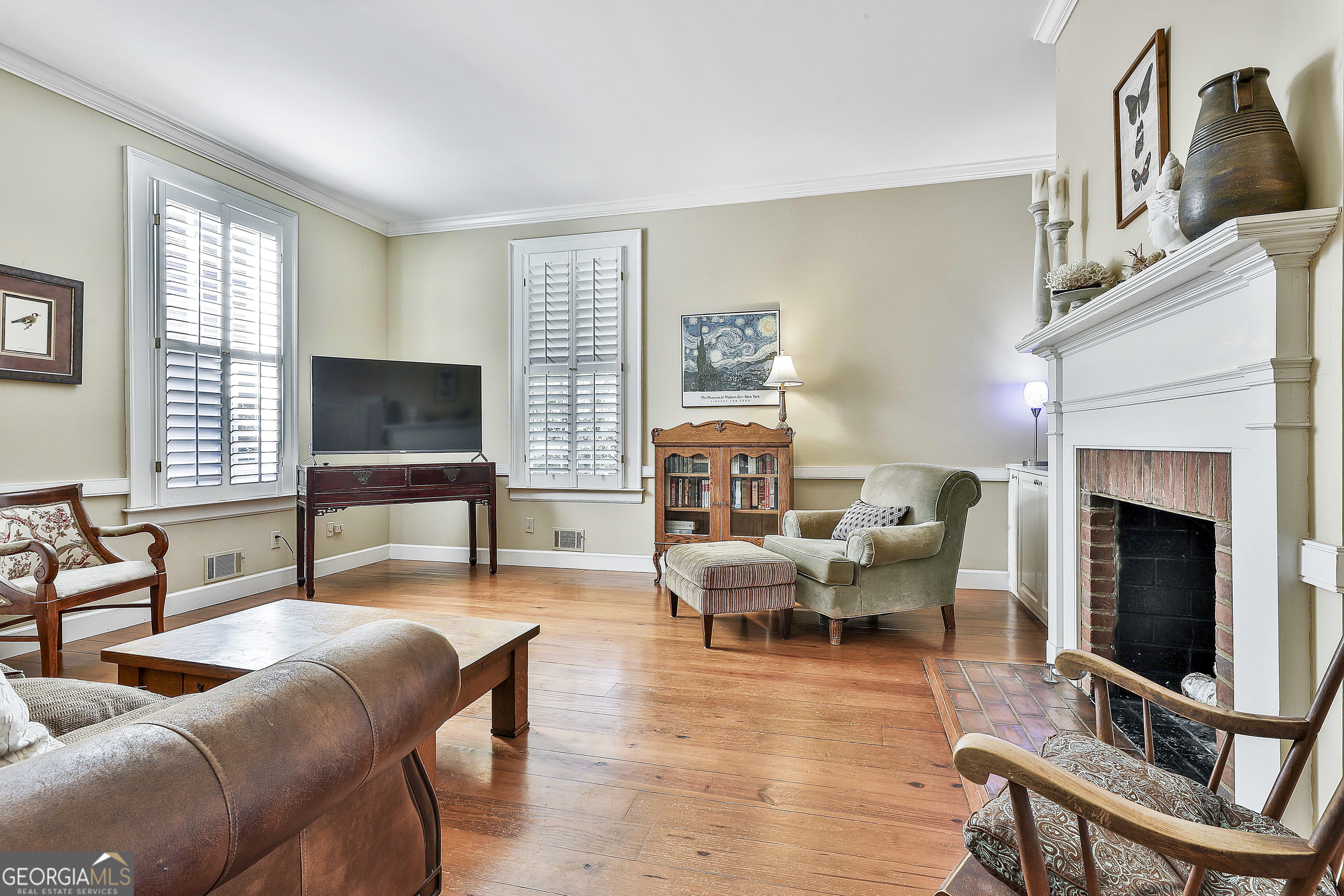 405 North Pine Hill Road Griffin, GA 30223 - Photo 30 of 72 a living room with furniture fireplace and window