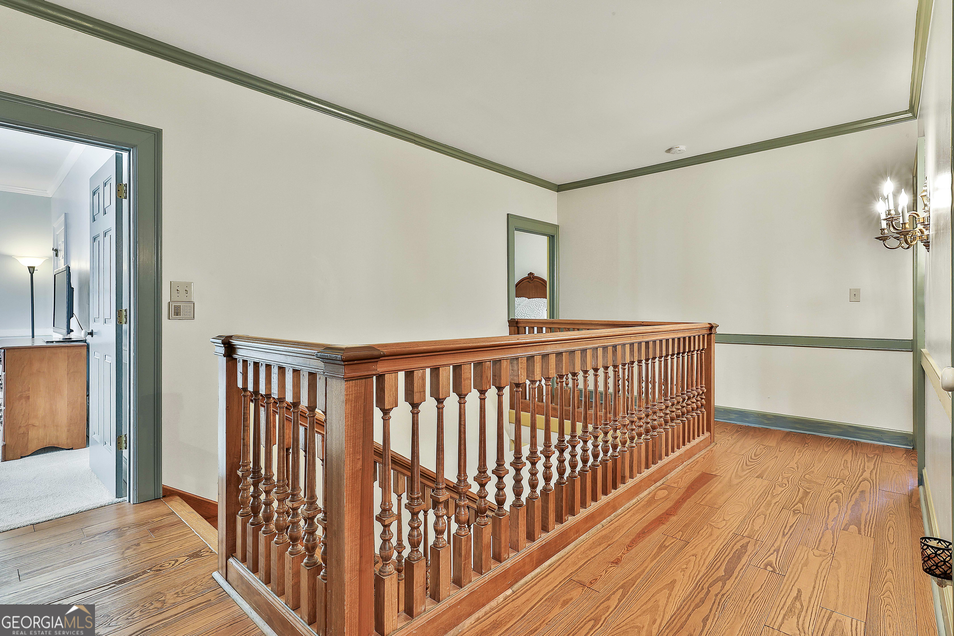405 North Pine Hill Road Griffin, GA 30223 - Photo 36 of 72 a view of a hallway with wooden floor
