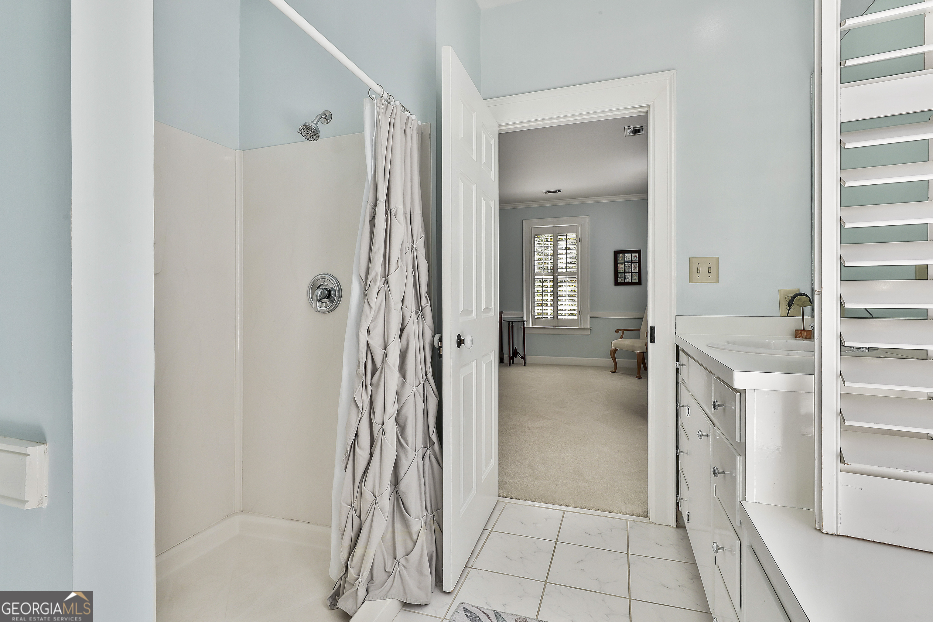 405 North Pine Hill Road Griffin, GA 30223 - Photo 41 of 72 a bathroom with a shower and a sink