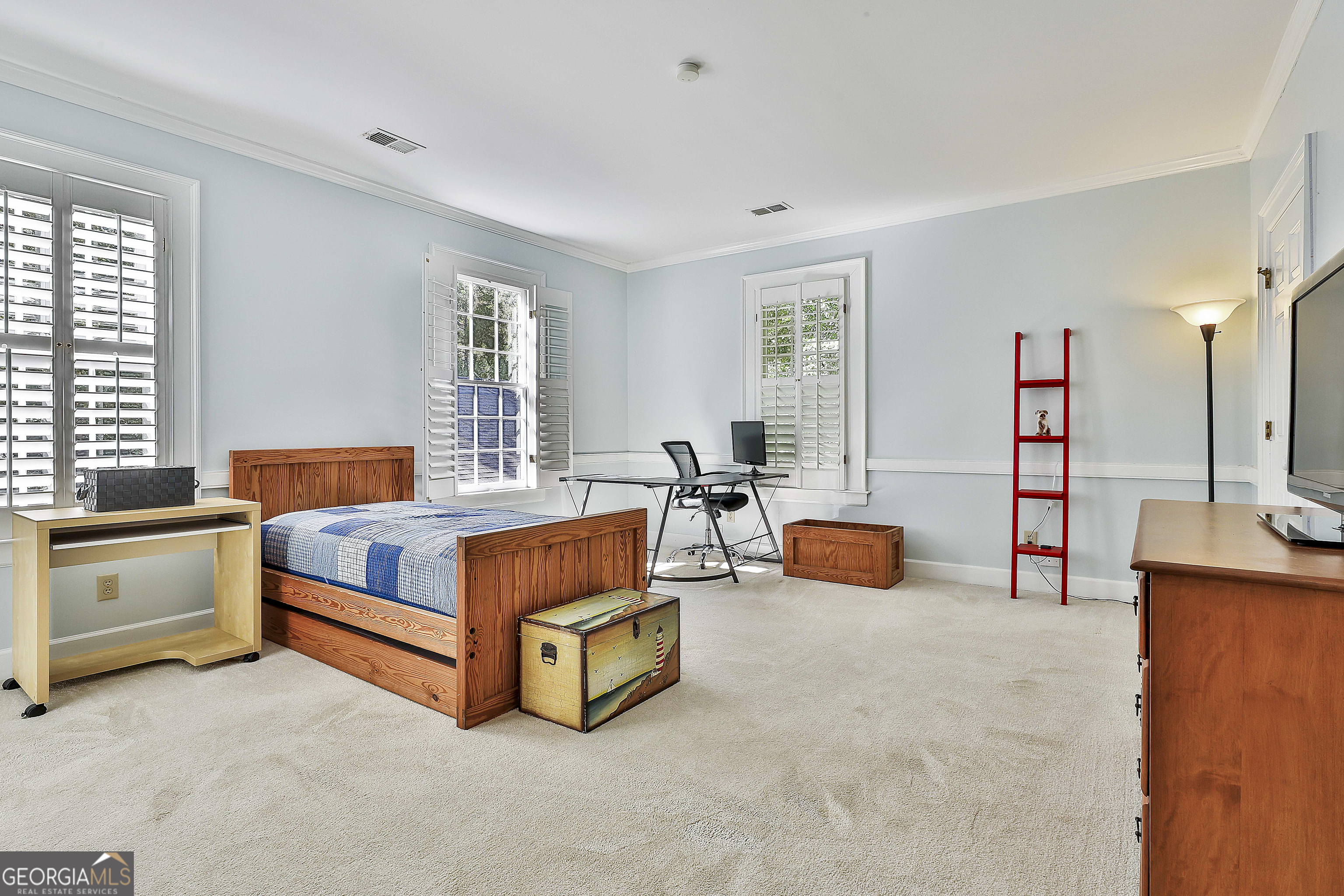 405 North Pine Hill Road Griffin, GA 30223 - Photo 42 of 72 a bedroom with bed and a couch