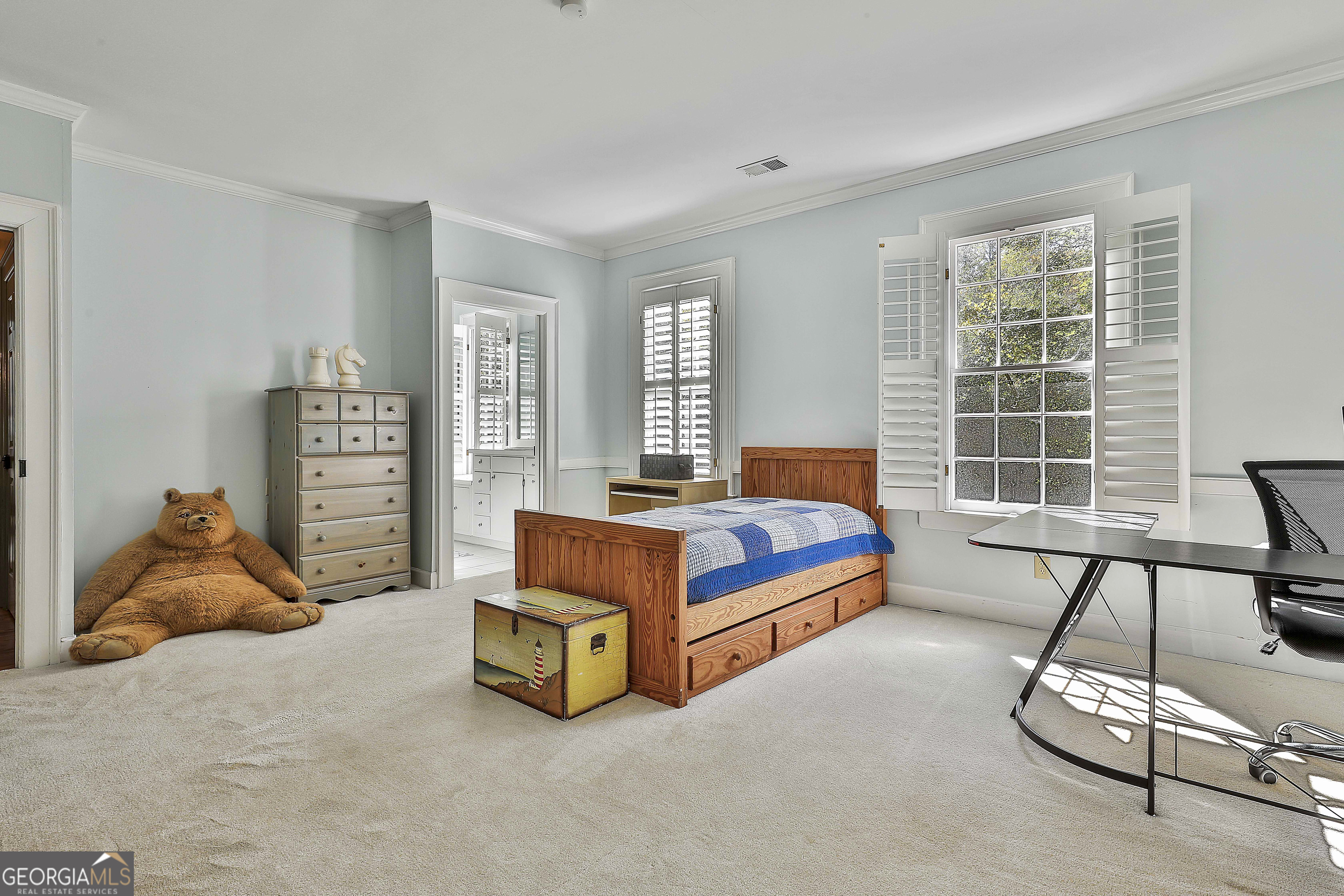 405 North Pine Hill Road Griffin, GA 30223 - Photo 43 of 72 a bedroom with a bed and a window