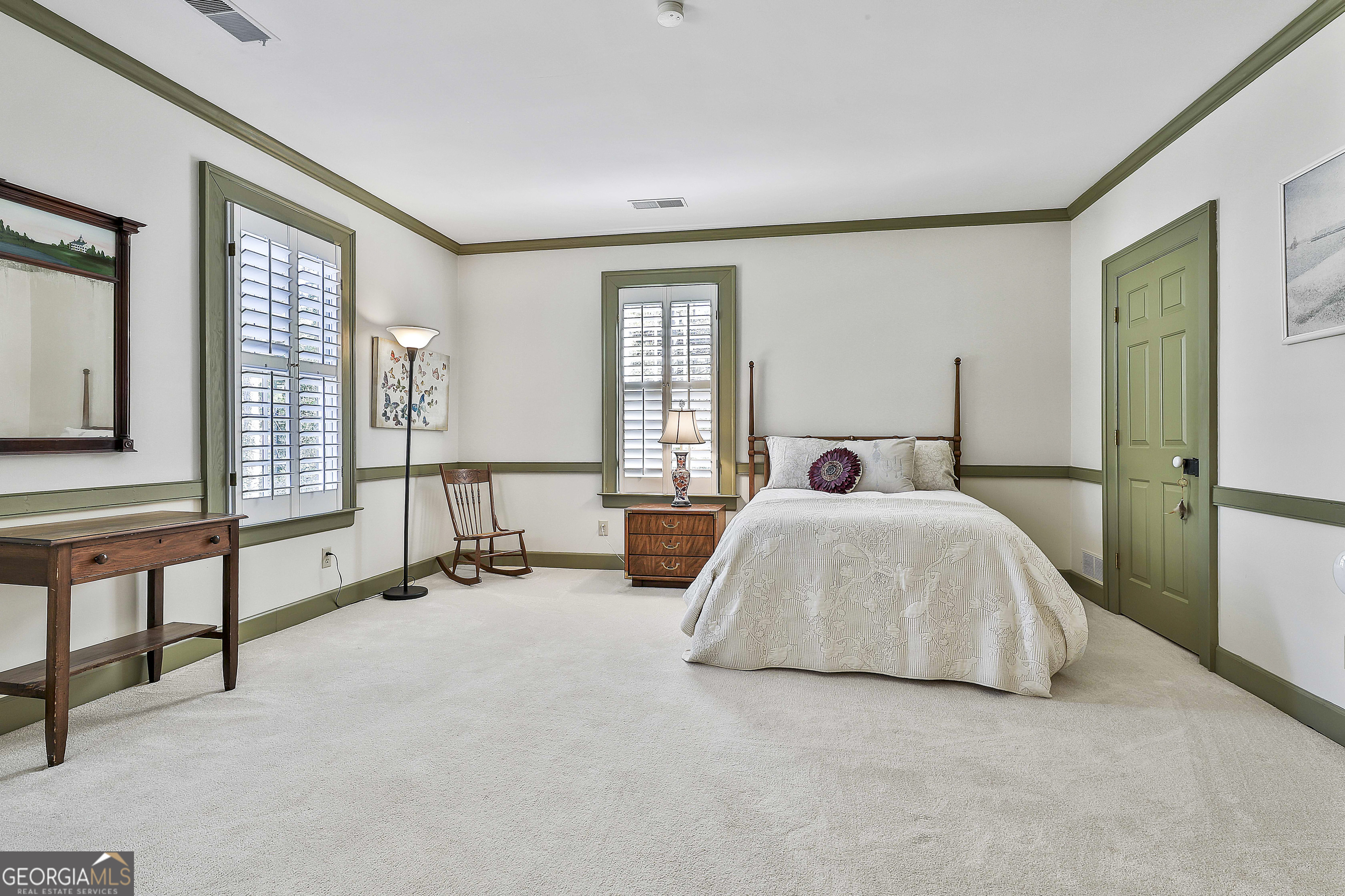 405 North Pine Hill Road Griffin, GA 30223 - Photo 44 of 72 a bedroom with a bed and a large window