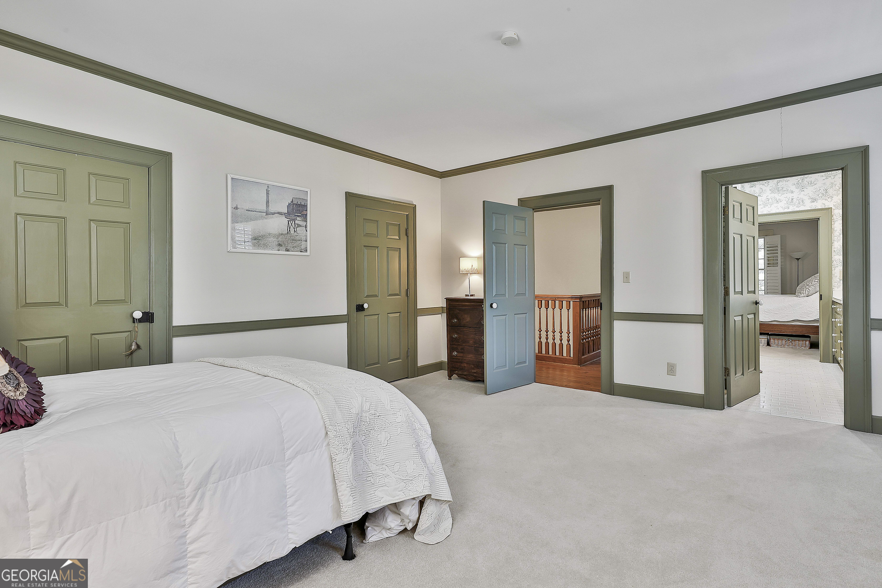 405 North Pine Hill Road Griffin, GA 30223 - Photo 46 of 72 a spacious bedroom with a bed and walk in closet