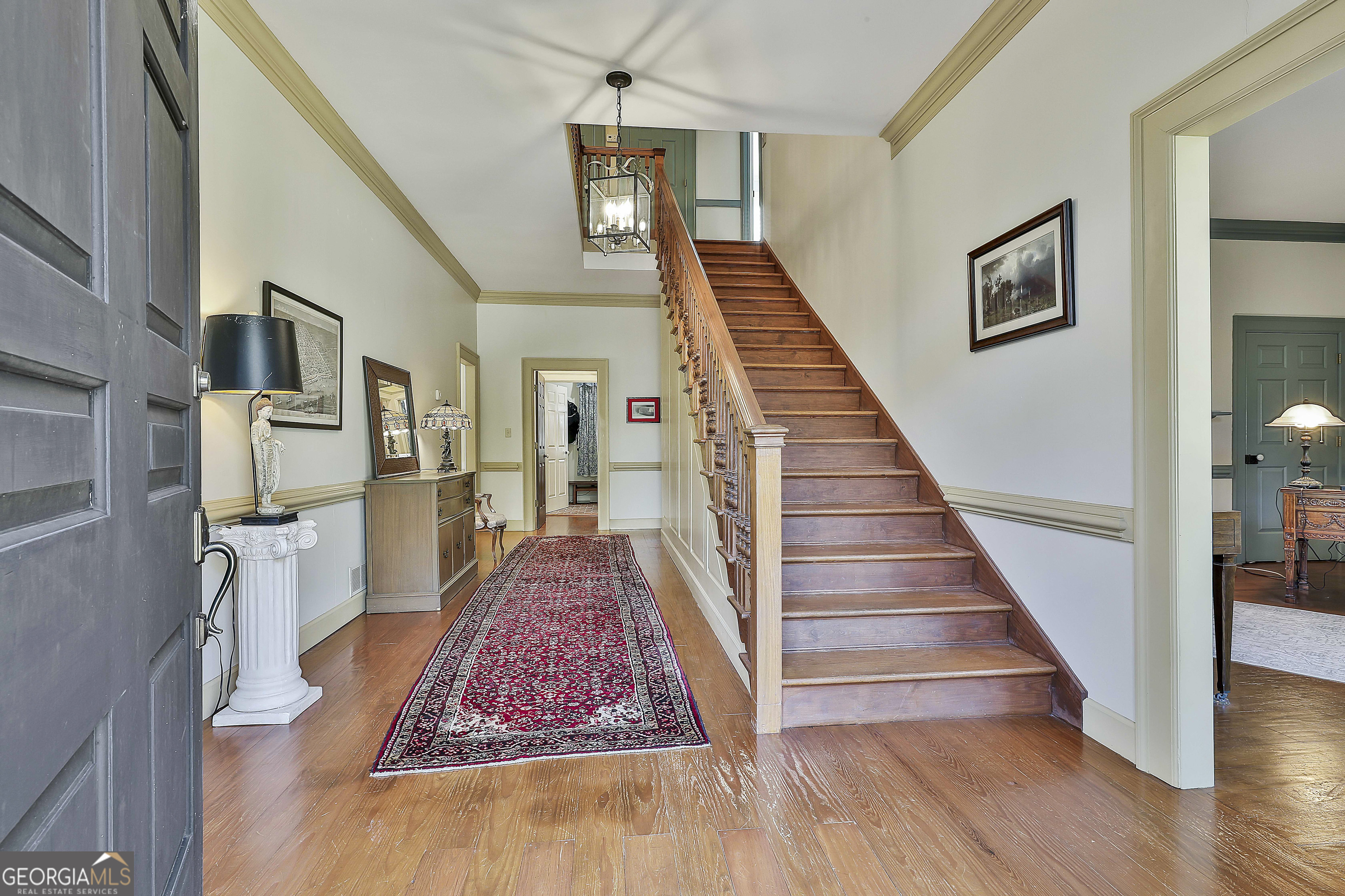 405 North Pine Hill Road Griffin, GA 30223 - Photo 7 of 72 a view of entryway and hall with wooden floor