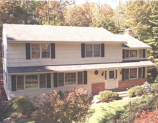 75 Marshall Road Ridgefield, CT 06877 - Photo 1 of 1 a front view of a house with a yard