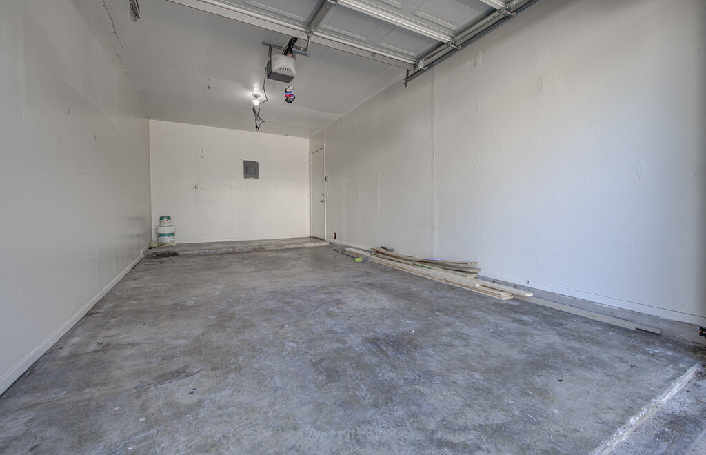 7908 West Gate Boulevard, Unit B Austin, TX 78745 - Photo 22 of 23 Garage with a garage door opener