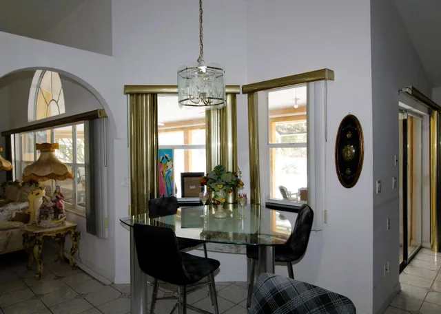 a view of a livingroom with furniture window and wooden floor
