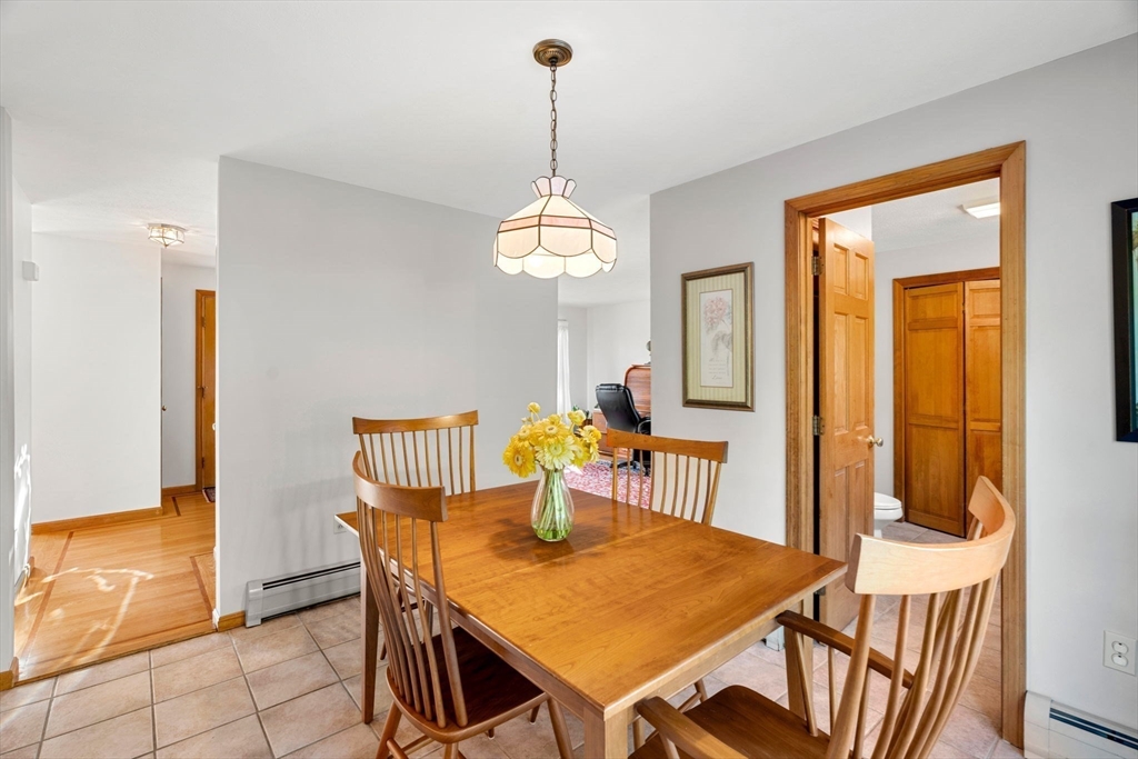 1 Stacey Lane Amesbury, MA 01913 - Photo 13 of 41 a view of a dining room with furniture window and wooden floor