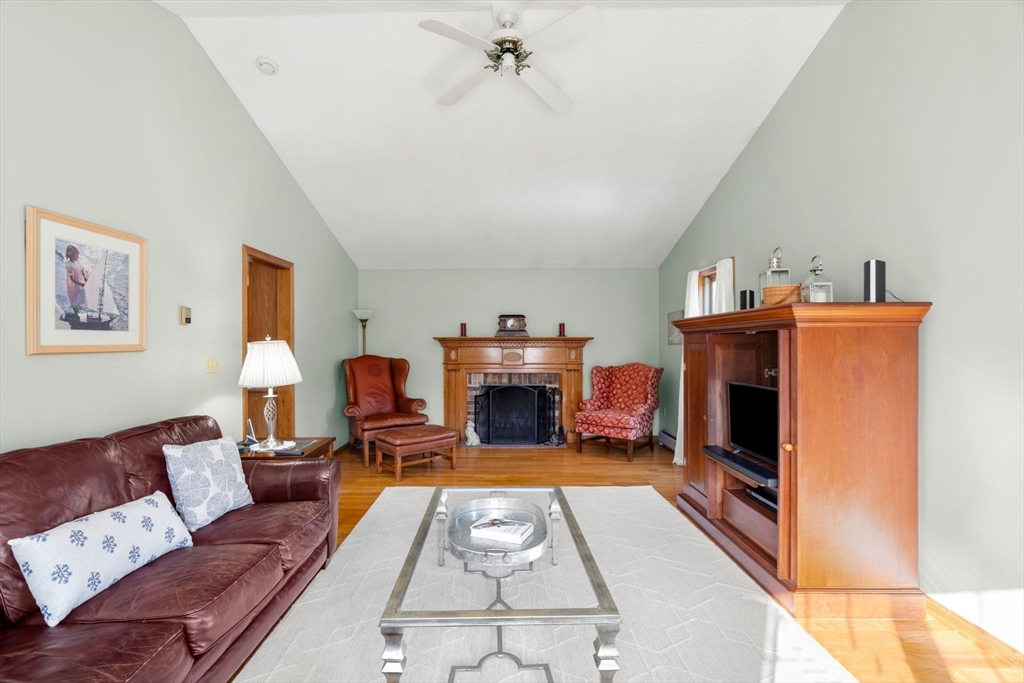 1 Stacey Lane Amesbury, MA 01913 - Photo 16 of 41 a living room with furniture and a fireplace
