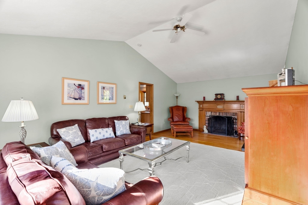 1 Stacey Lane Amesbury, MA 01913 - Photo 17 of 41 a living room with furniture and a fireplace