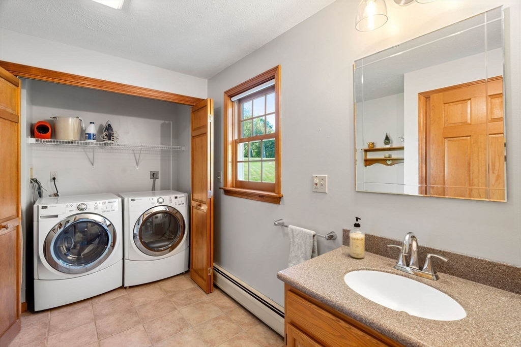 1 Stacey Lane Amesbury, MA 01913 - Photo 21 of 41 a utility room with sink dryer and washer