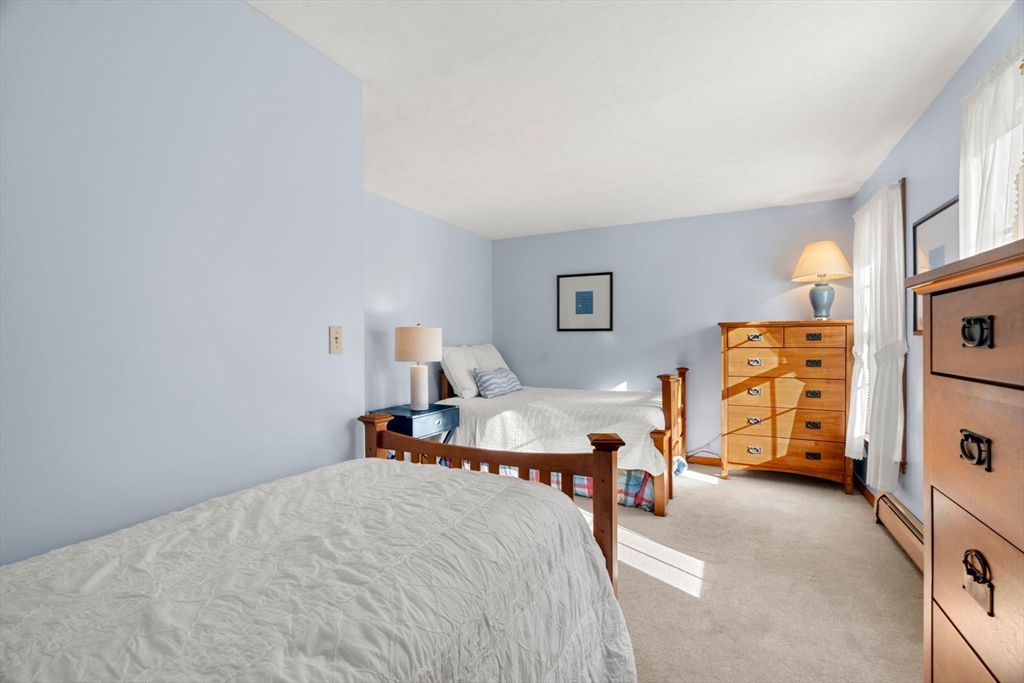 1 Stacey Lane Amesbury, MA 01913 - Photo 25 of 41 a bedroom with a bed and a tv