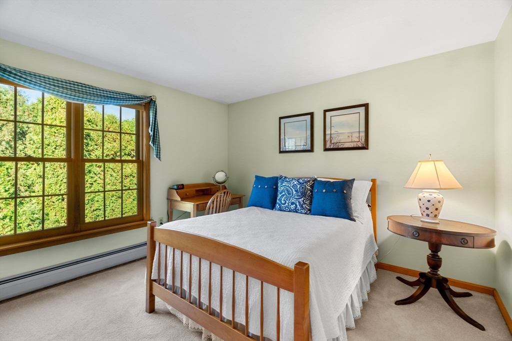 1 Stacey Lane Amesbury, MA 01913 - Photo 26 of 41 a bedroom with a bed and a large window