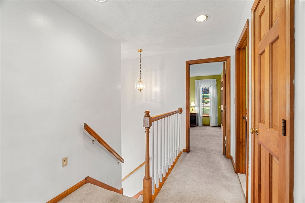 1 Stacey Lane Amesbury, MA 01913 - Photo 27 of 41 a view of a hallway with wooden floor and entryway