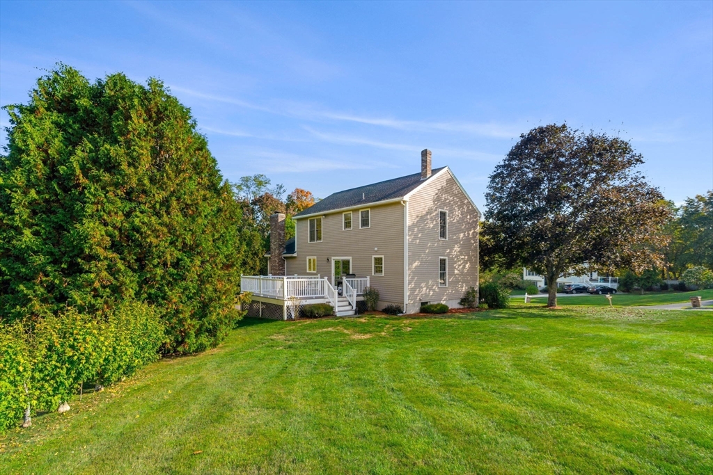1 Stacey Lane Amesbury, MA 01913 - Photo 35 of 41 a view of a house with a yard and sitting area