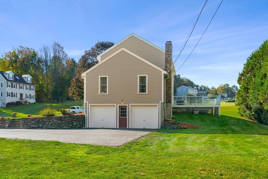1 Stacey Lane Amesbury, MA 01913 - Photo 5 of 41 a view of a house with a yard