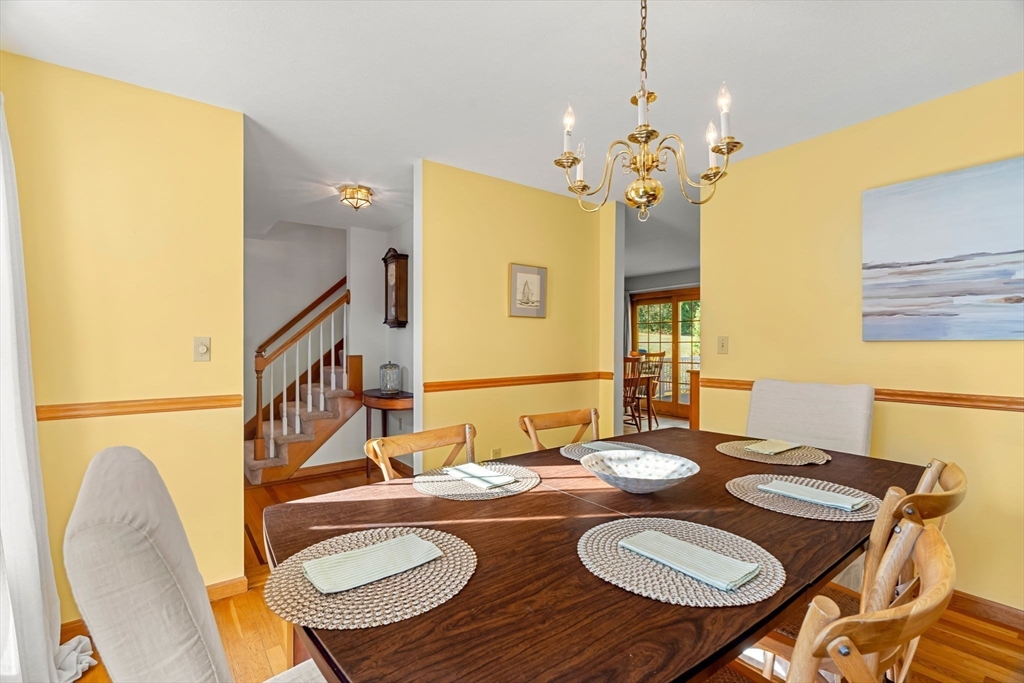 1 Stacey Lane Amesbury, MA 01913 - Photo 6 of 41 a view of a dining room with furniture and wooden floor
