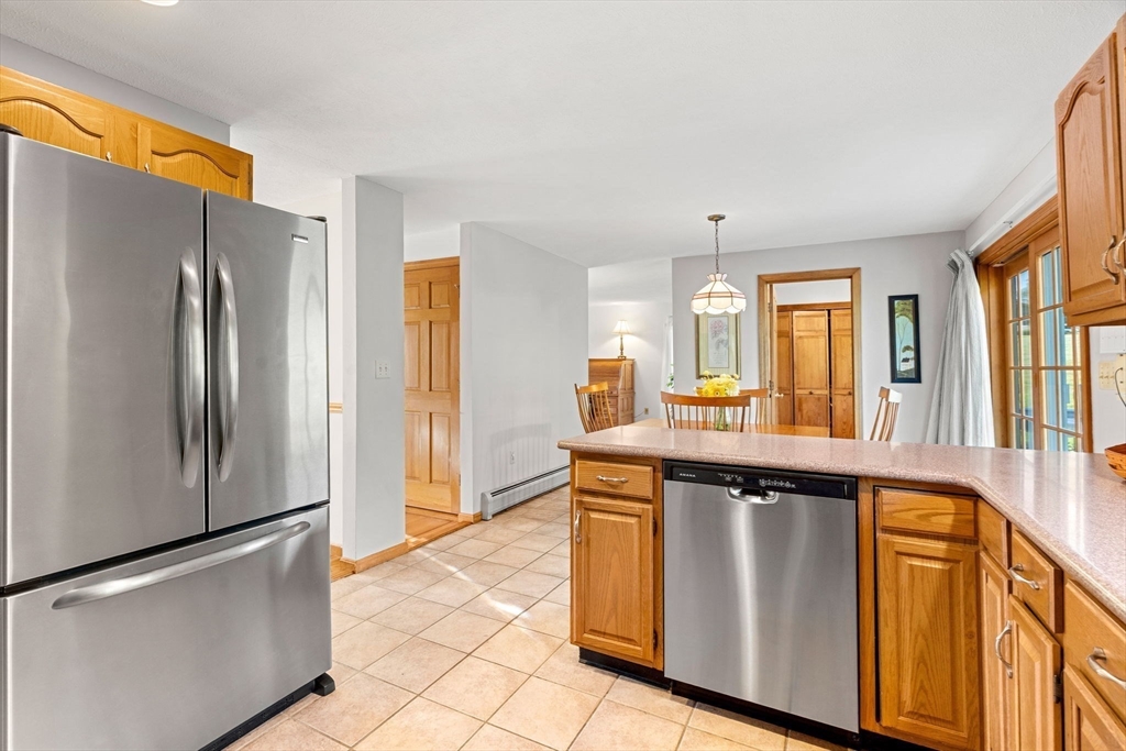 1 Stacey Lane Amesbury, MA 01913 - Photo 10 of 41 a kitchen with stainless steel appliances a refrigerator and a stove