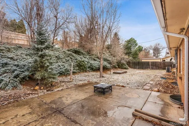 a view of backyard with outdoor seating
