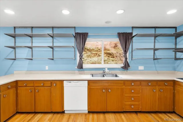 a kitchen with a sink a cabinets and window
