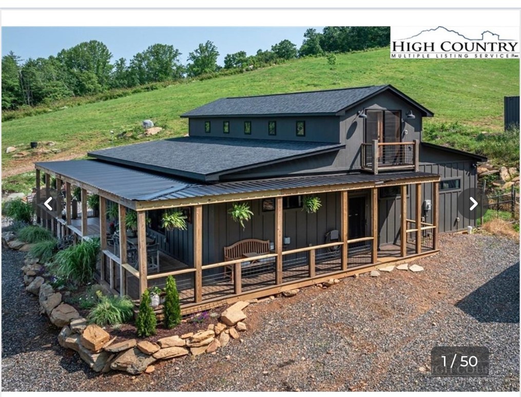 509 Grant Houck Road Todd, NC 28684 - Photo 4 of 43 a view of a house with a yard balcony and outdoor seating