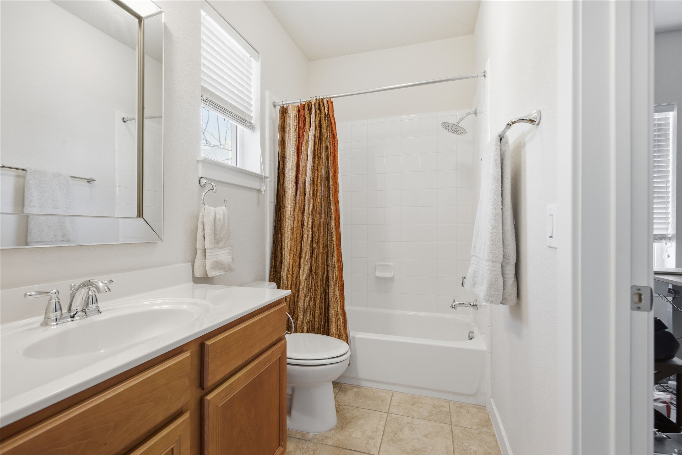 3900 Threadgill Street, Unit 2 Austin, TX 78723 - Photo 15 of 19 Second bathroom also features new Moen shower head and is immaculately maintained.