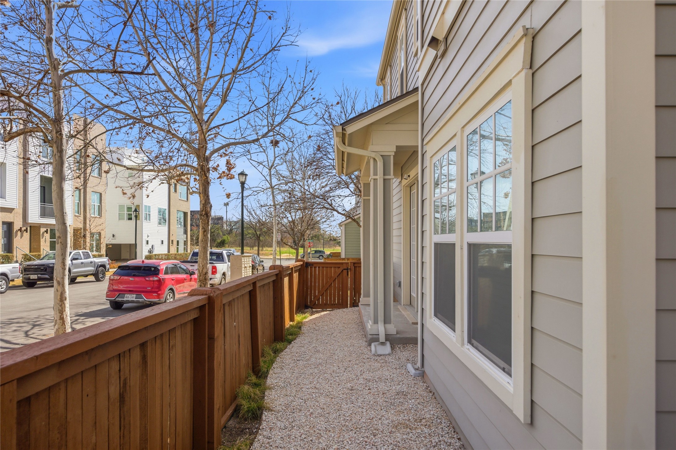 3900 Threadgill Street, Unit 2 Austin, TX 78723 - Photo 16 of 19 The side yard is beautifully landscaped with limestone gravel and steel edging.