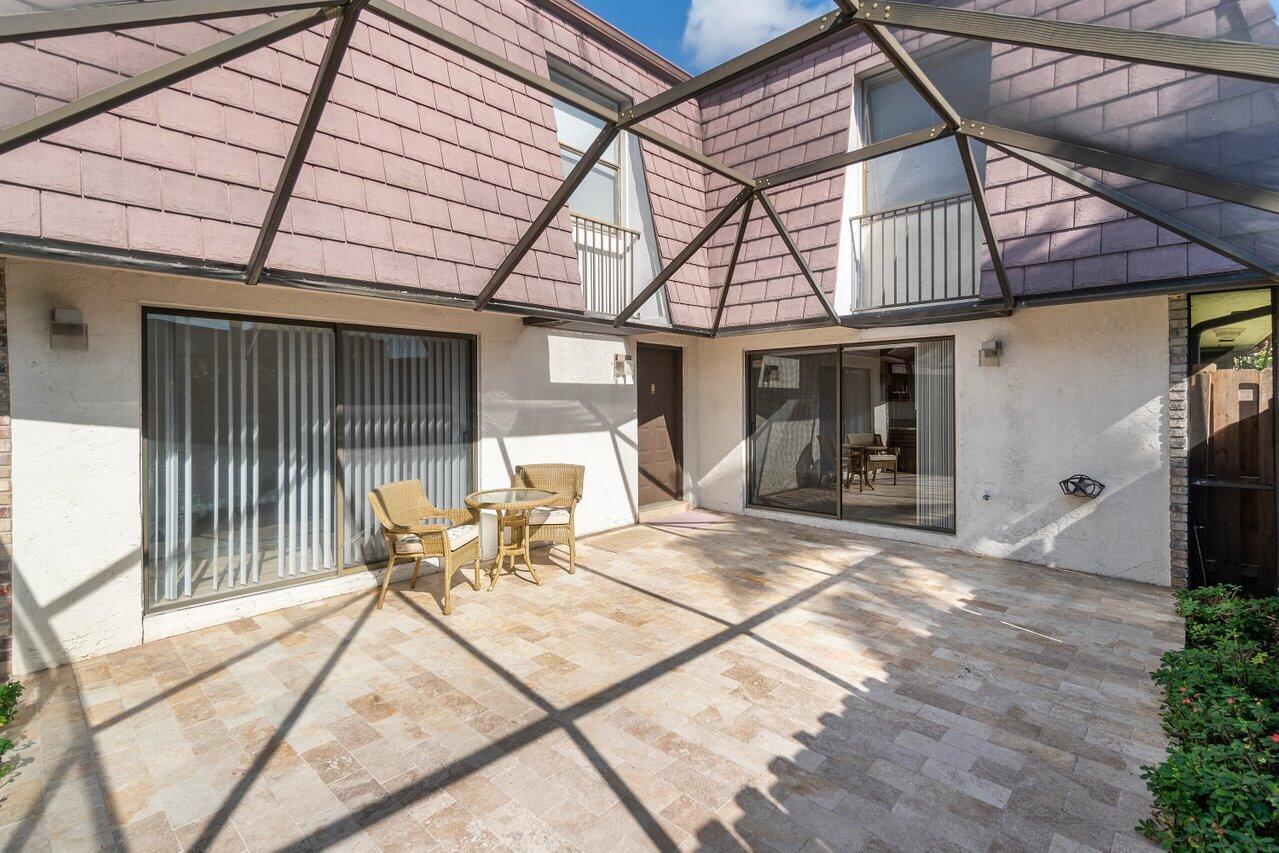 7689 Courtyard Run West Boca Raton, FL 33433 - Photo 4 of 27 Tumbled marble deck