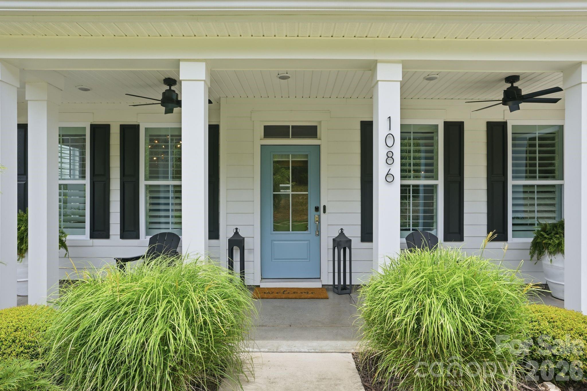 1086 Weir Court Fort Mill, SC 29708 - Photo 3 of 40 a front view of a house with garden