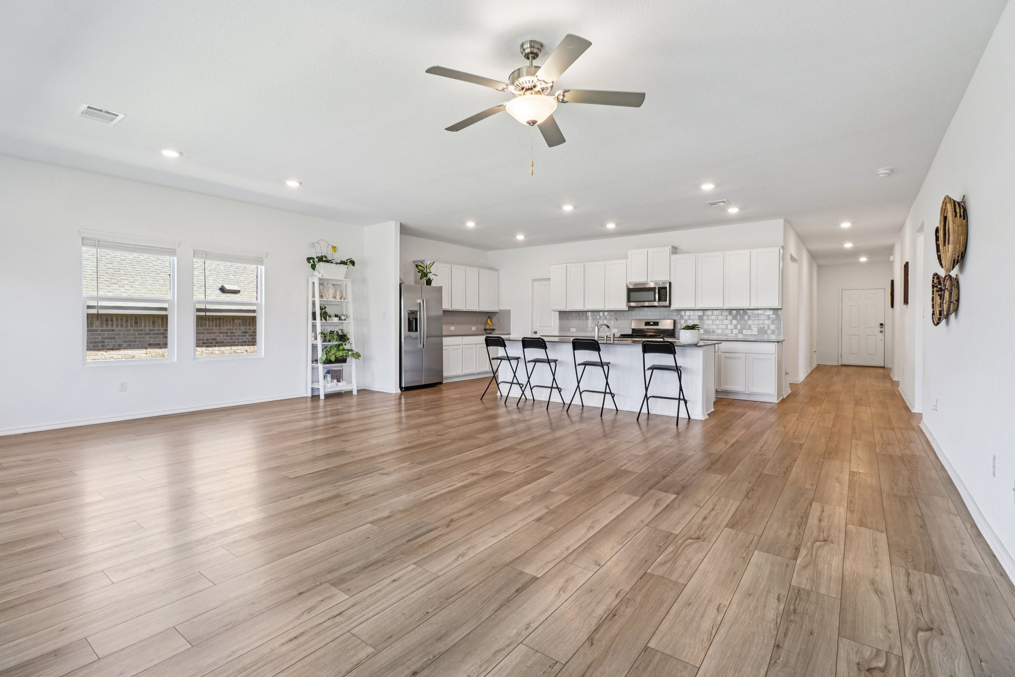 1201 Mallow Road Leander, TX 78641 - Photo 12 of 40 Living room with ceiling fan, recessed lighting, and light wood finished floors