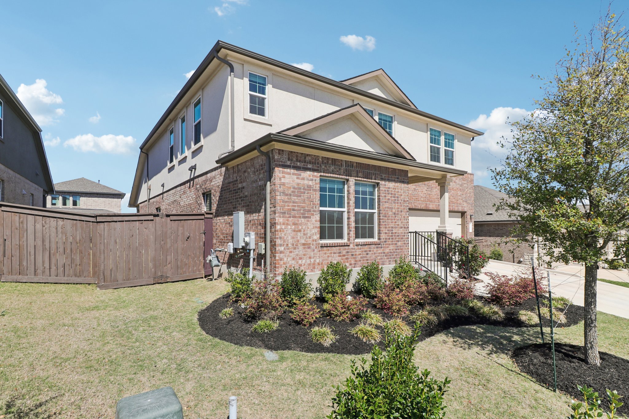 1201 Mallow Road Leander, TX 78641 - Photo 2 of 40 View of property exterior featuring brick siding and stucco siding