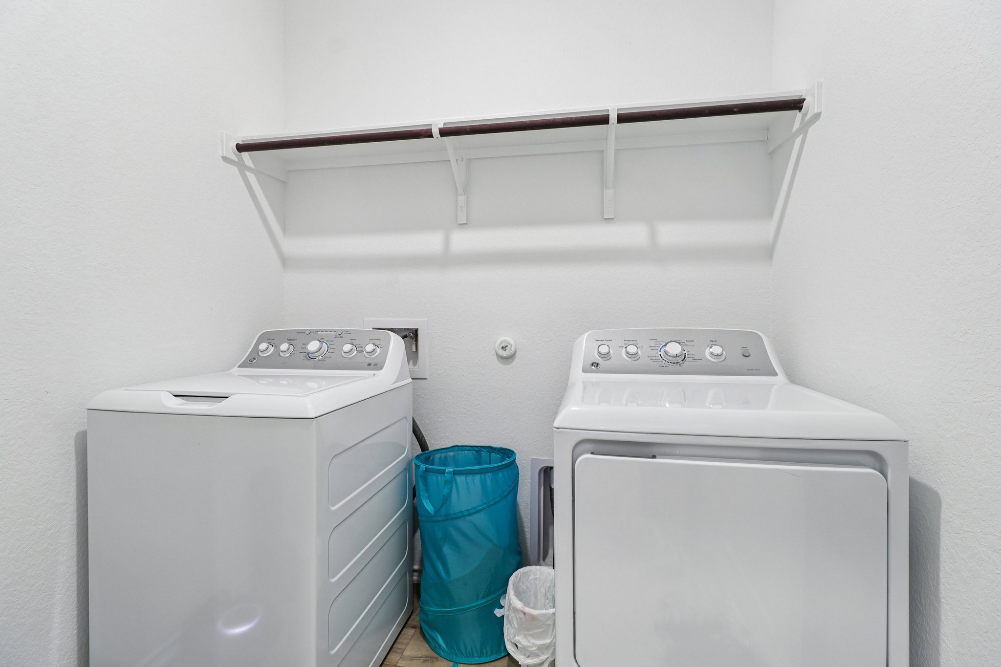 1201 Mallow Road Leander, TX 78641 - Photo 35 of 40 Laundry area with a textured wall and separate washer and dryer