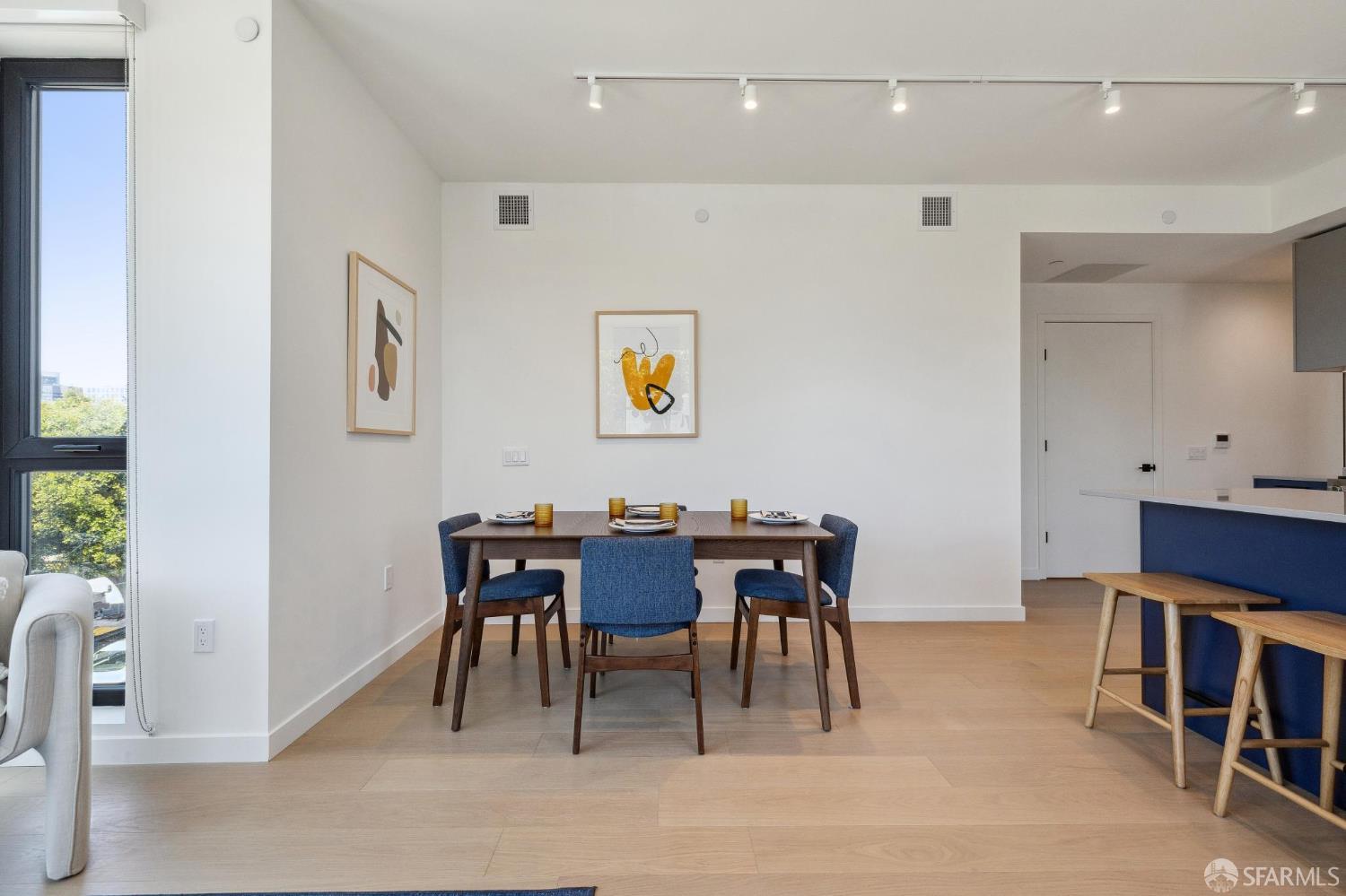 988 Harrison Street, Unit 707 San Francisco, CA 94107 - Photo 11 of 24 a view of a dining room with furniture