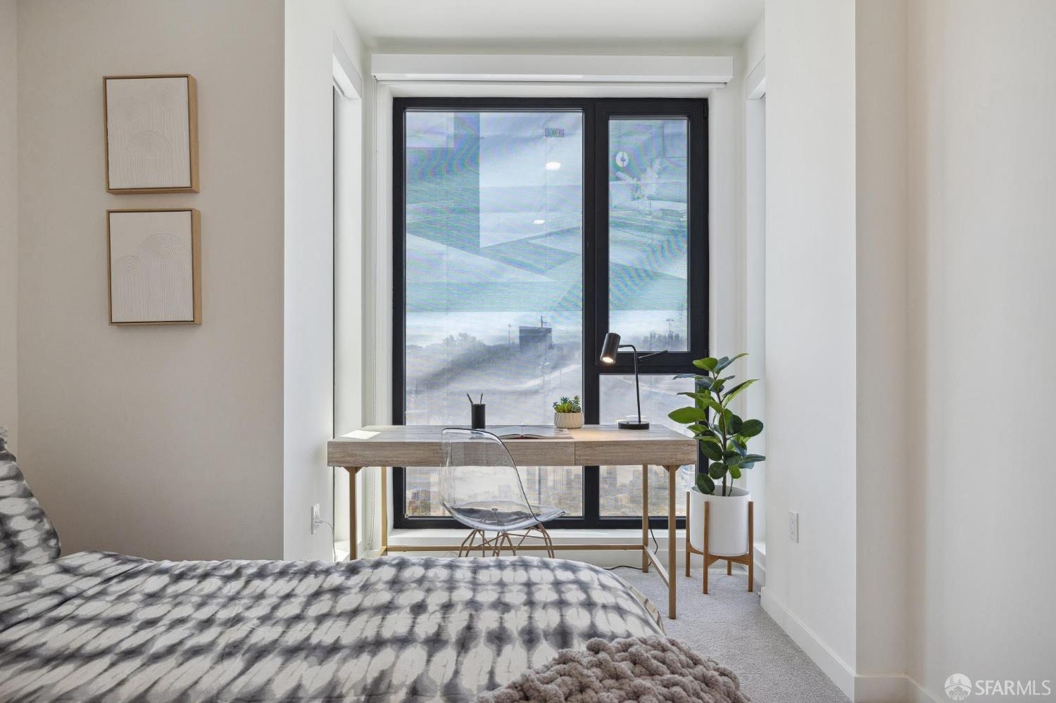 988 Harrison Street, Unit 707 San Francisco, CA 94107 - Photo 13 of 24 a bedroom with a bed and a window