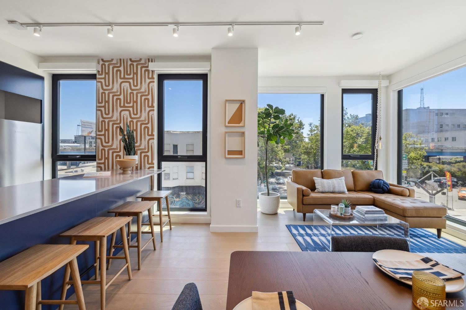 988 Harrison Street, Unit 707 San Francisco, CA 94107 - Photo 7 of 24 a living room with furniture and a large window