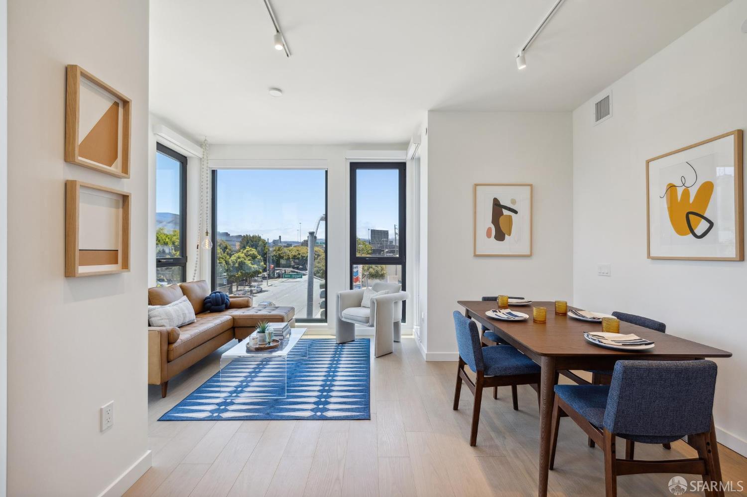 988 Harrison Street, Unit 707 San Francisco, CA 94107 - Photo 9 of 24 a living room with furniture and a large window