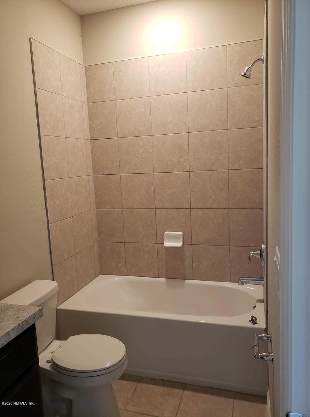 5370 Kellar Circle Jacksonville, FL 32218 - Photo 11 of 21 a view of a bathroom with a tub and toilet