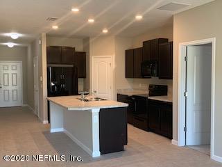 5370 Kellar Circle Jacksonville, FL 32218 - Photo 14 of 21 a kitchen with stainless steel appliances granite countertop a refrigerator and a stove top oven